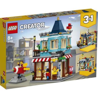 image LEGO Creator 3in1 Le magasin de jouets du centre-ville, Pâtisserie, Fleuriste, Ensemble de construction avec fusée fonctionnelle, 127 pièces, 31105